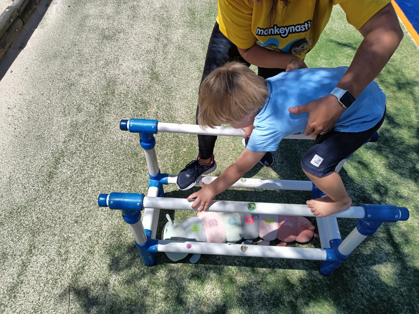 Child on the outdoor monkey-bar course