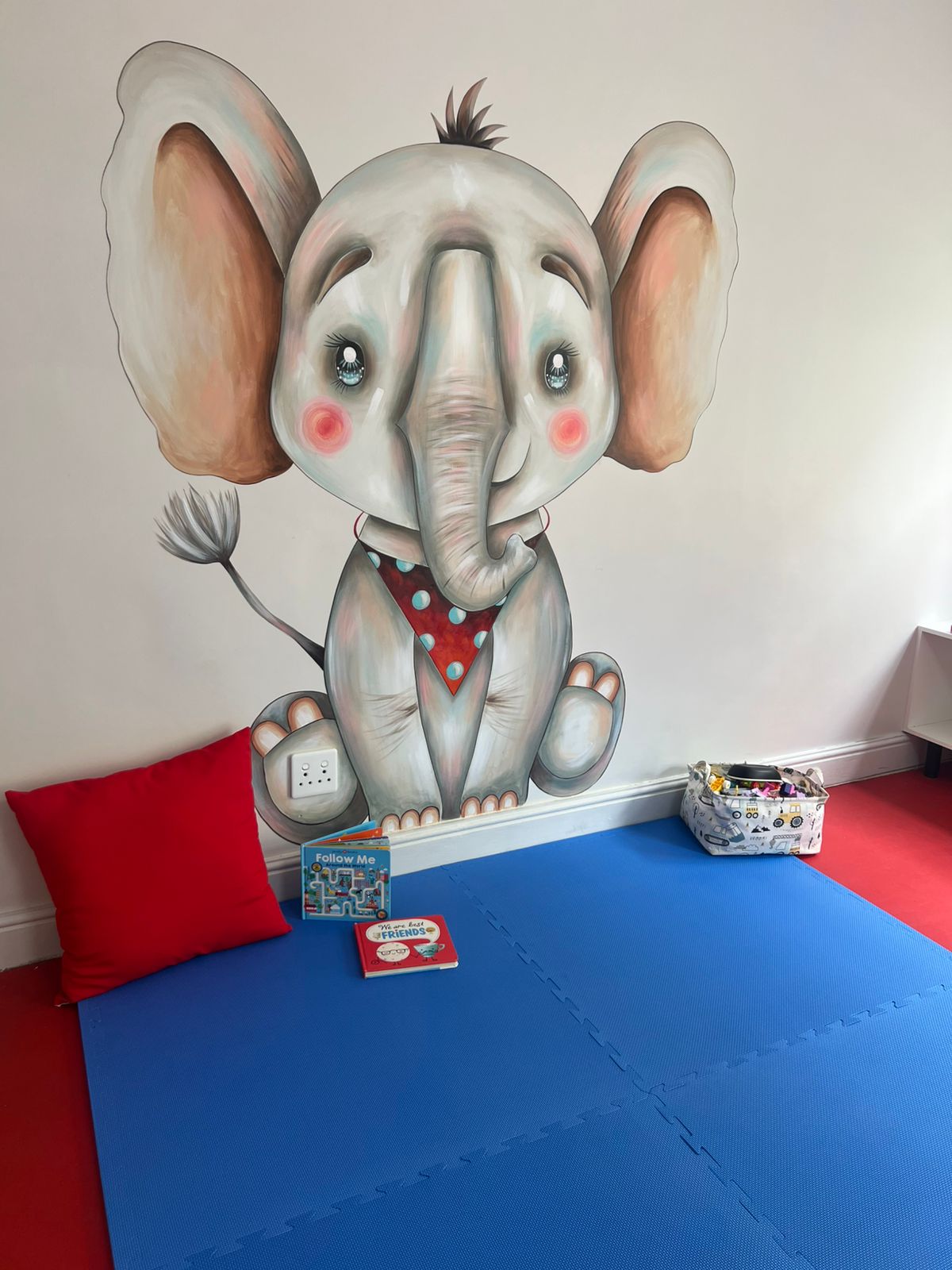 Playroom with a hand-painted elephant mural